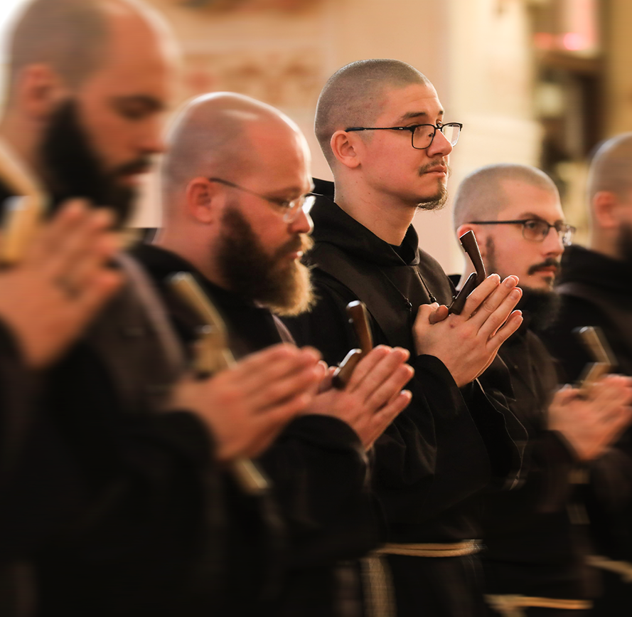 Friars praying together