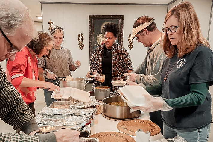 People serving food at the retreat