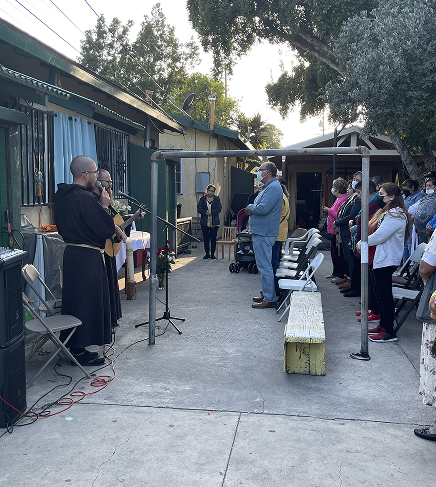 Friar preaching outdoors