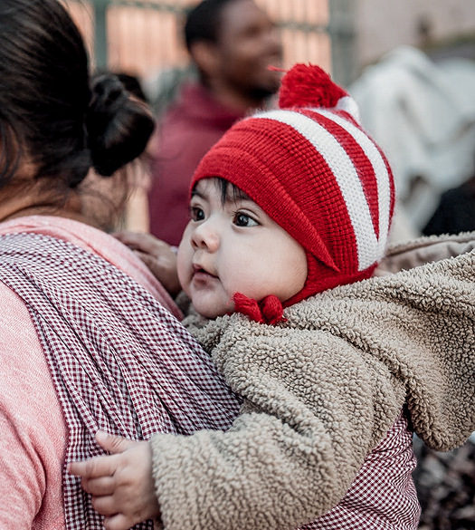 Baby wearing a red beanie