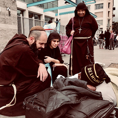 Friars with a woman on the street