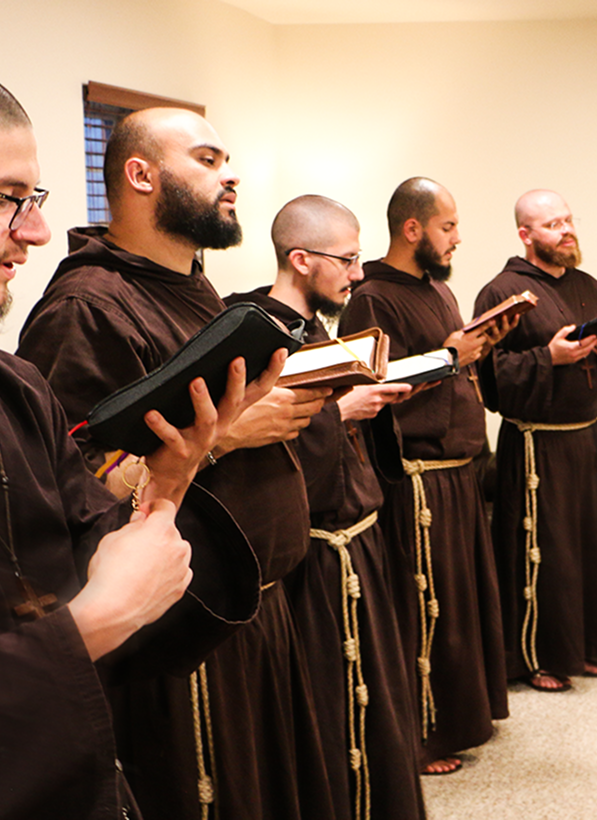 Friars praying and reading together
